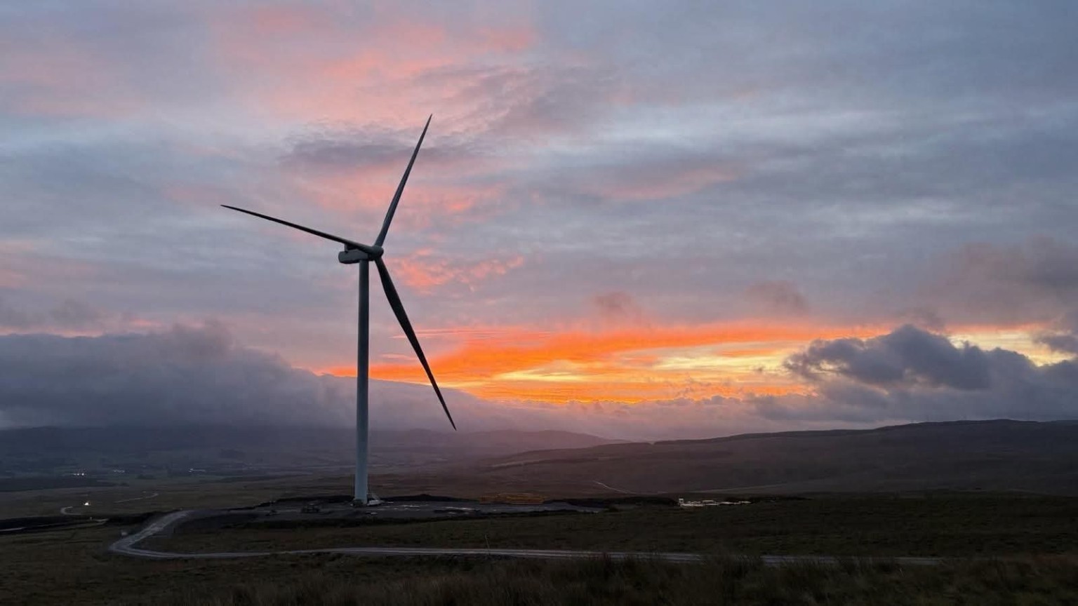 Wind turbine at sunset